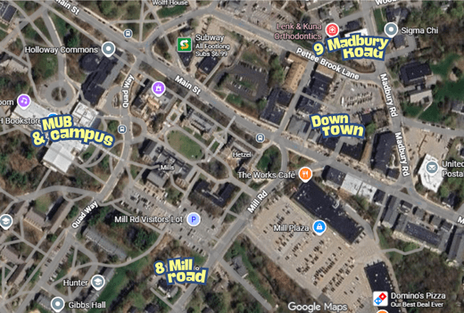 Woman using a rowing machine with workout revolution text.